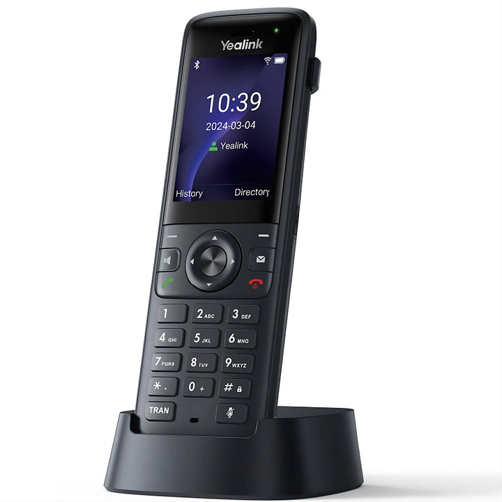 Yealink AX83H Portable Wi-Fi 6 IP Phone shown in charging cradle, featuring a 2.4" color screen and seamless roaming technology.