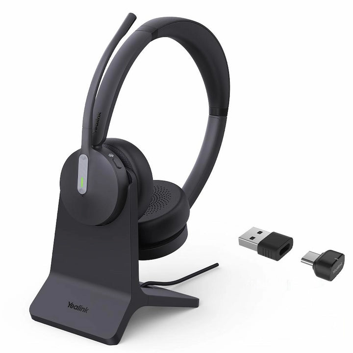 Yealink BH70 Dual Teams Bluetooth headset docked on BHC70 charging stand with USB-C/A connectivity.